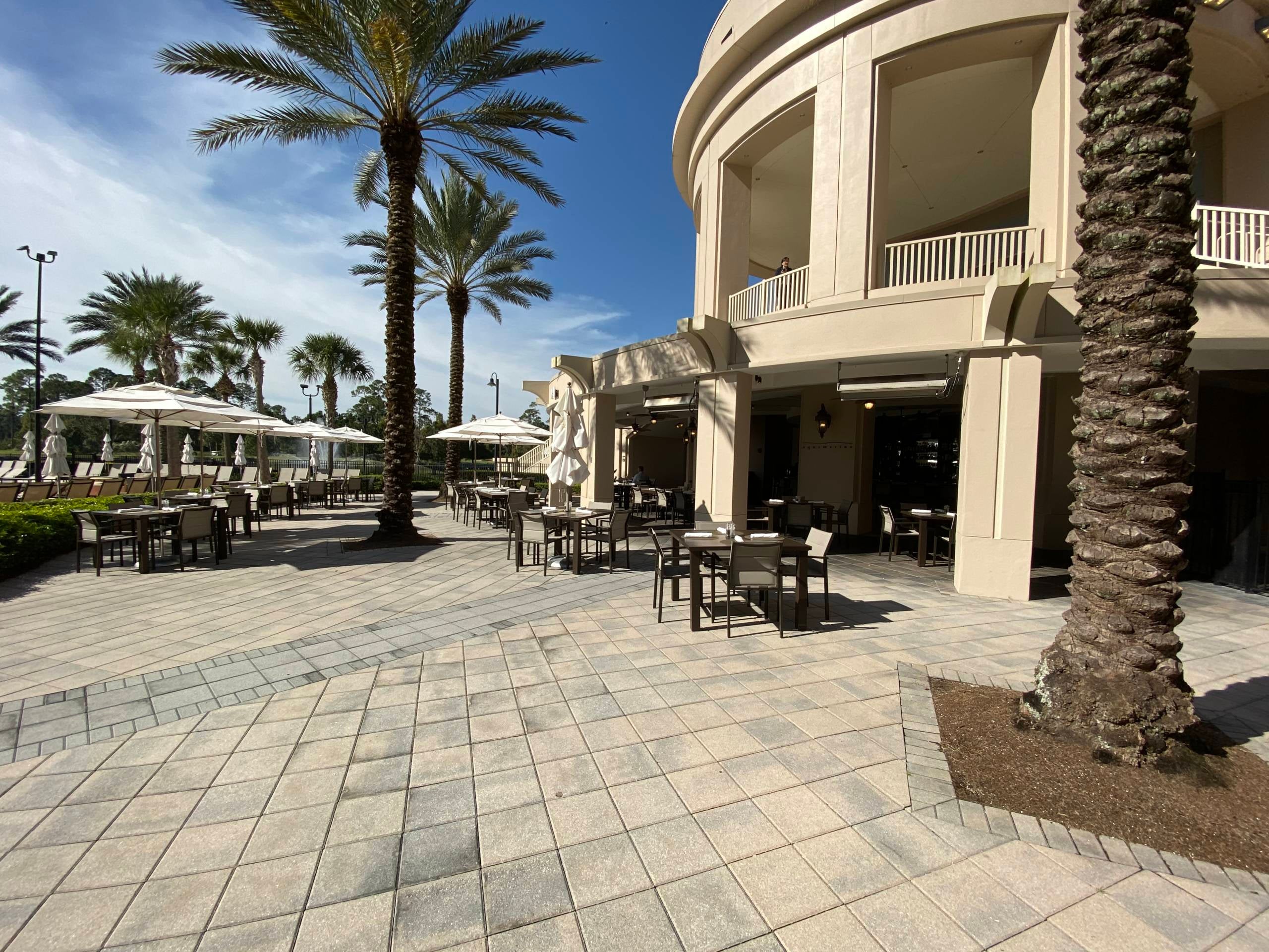 outdoor seating at Aquamarine pool bar/restaurant at Waldorf Astoria Orlando
