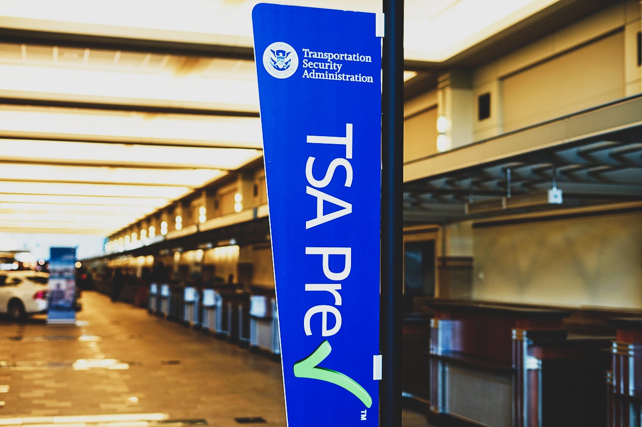 Sign encouraging passengers to register for the time-saving TSA Prec Check program in the United Airlines (UA) terminal at the Chicago O'Hare International Airport (ORD). (Photo by Shutterstock.com)