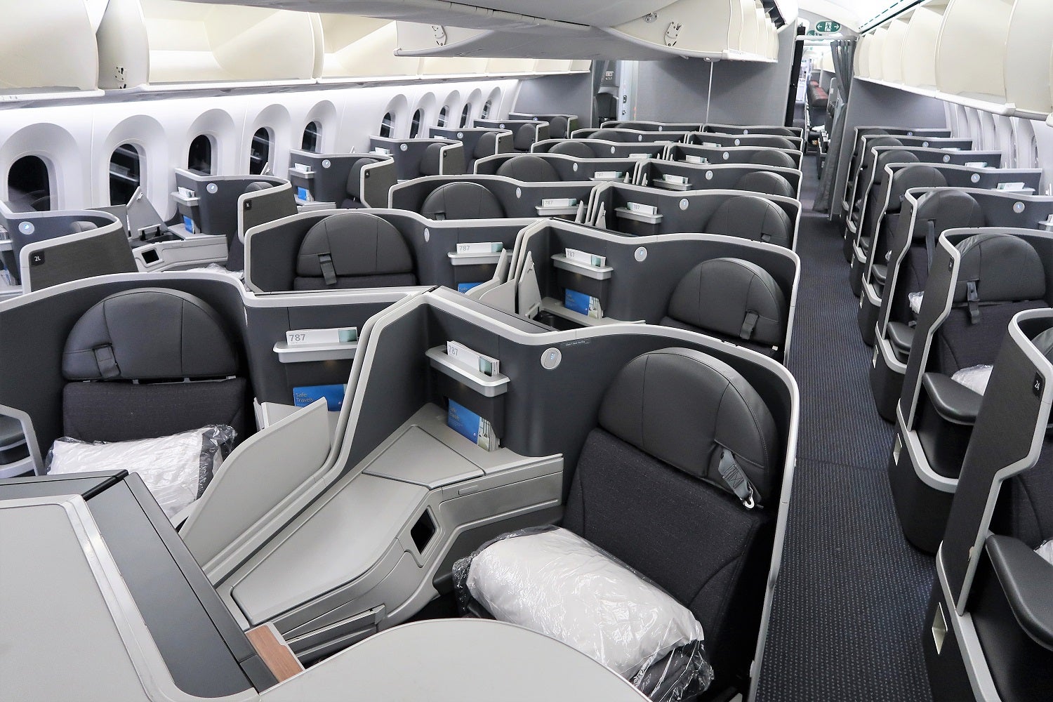 empty seats in a business class cabin on a plane
