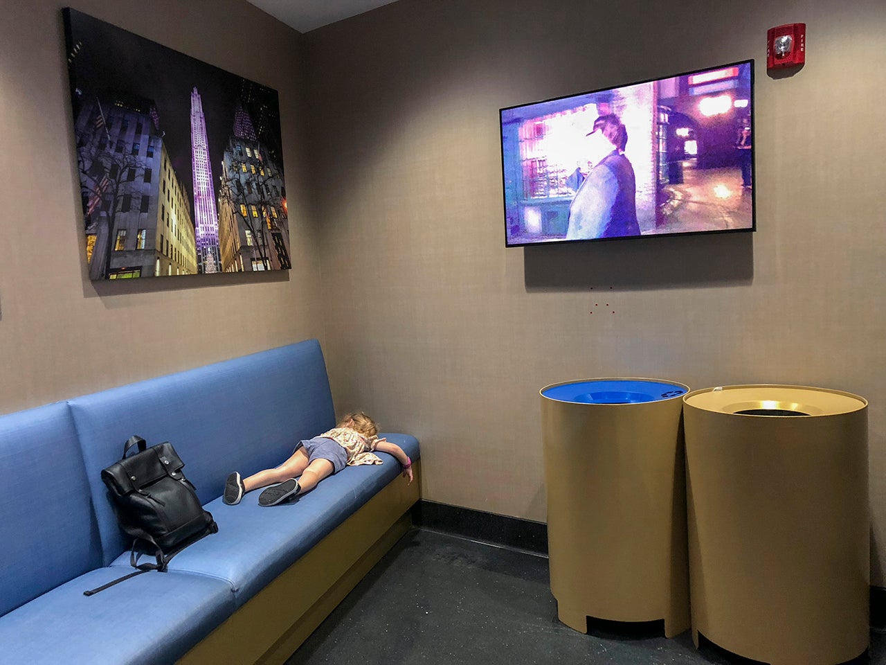 A child laying on a couch at Universal Orlando Resort child waiting rooms