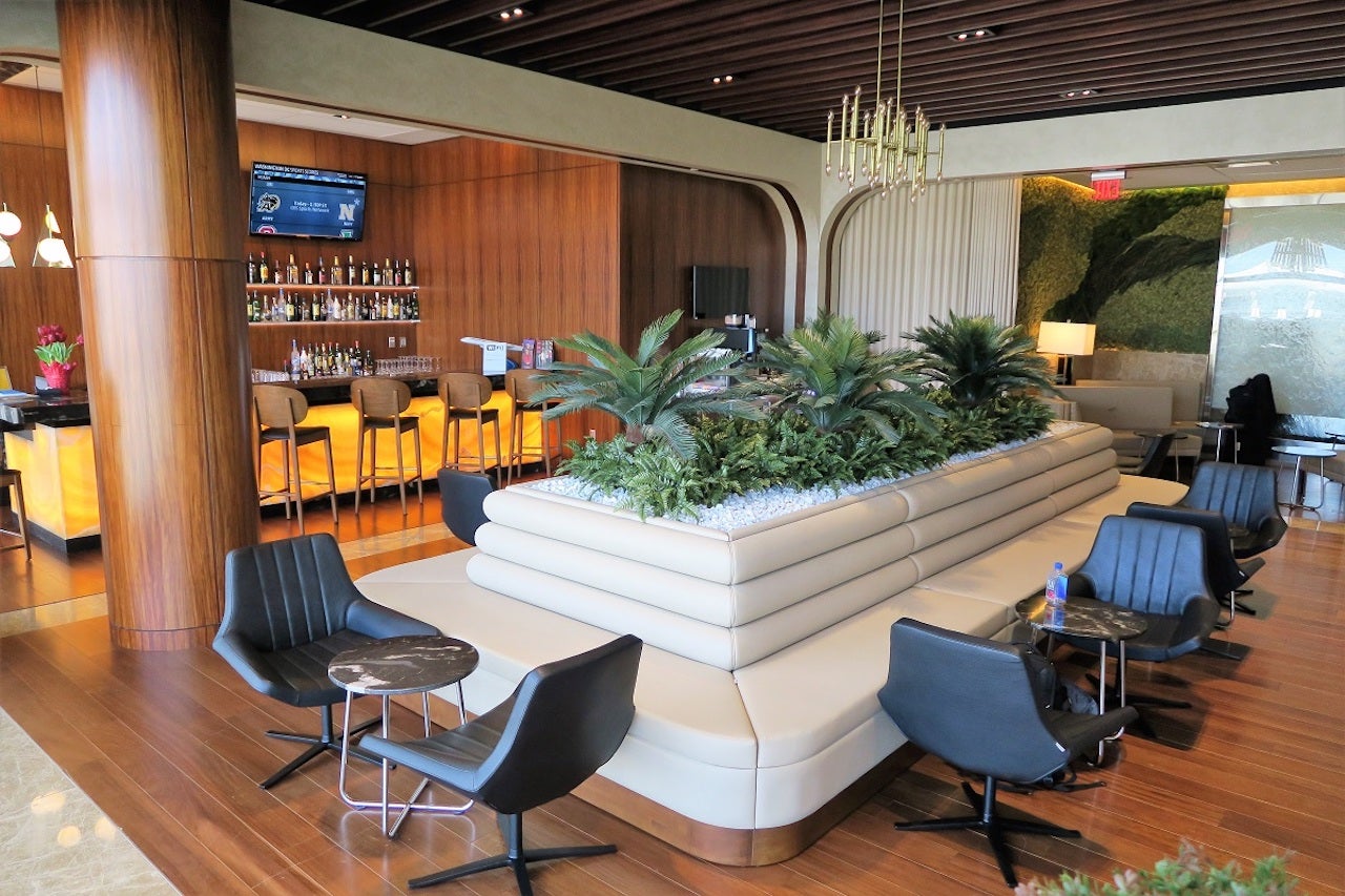 seating and a bar at an airport lounge