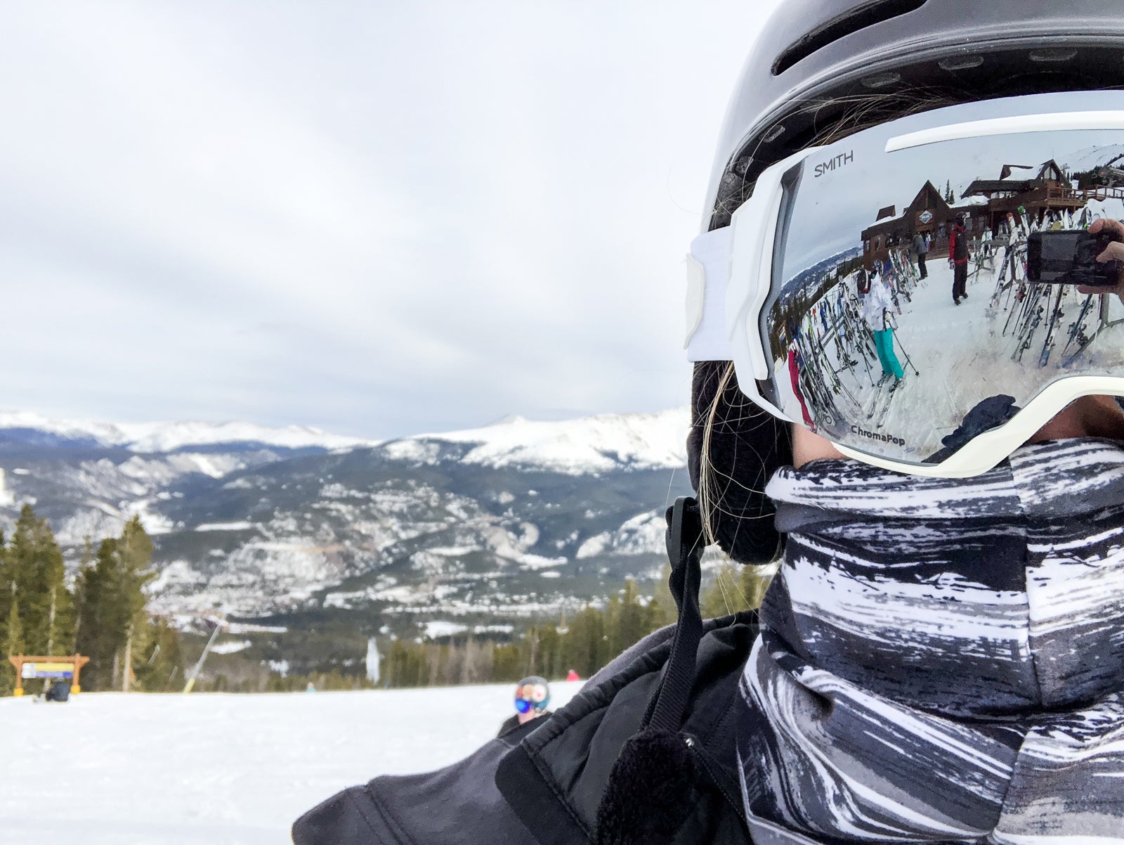 person wearing ski goggles and helmet