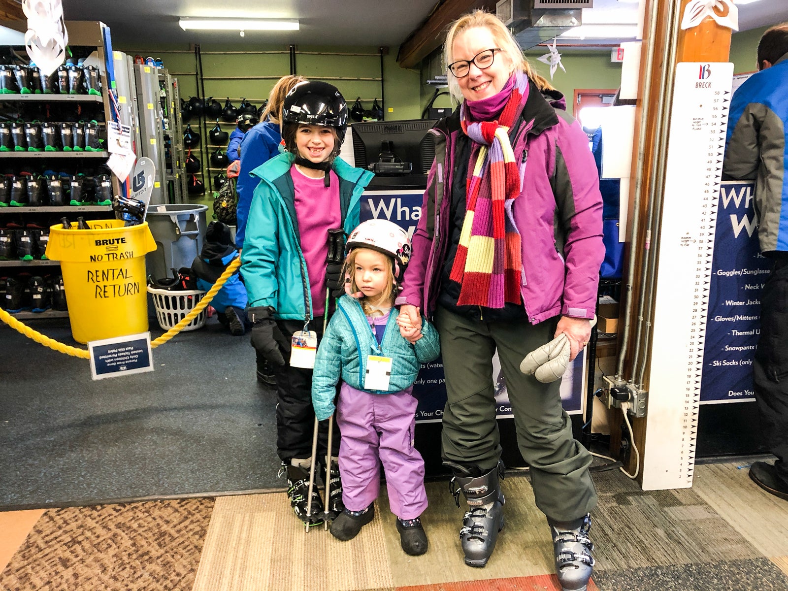 family in ski shop