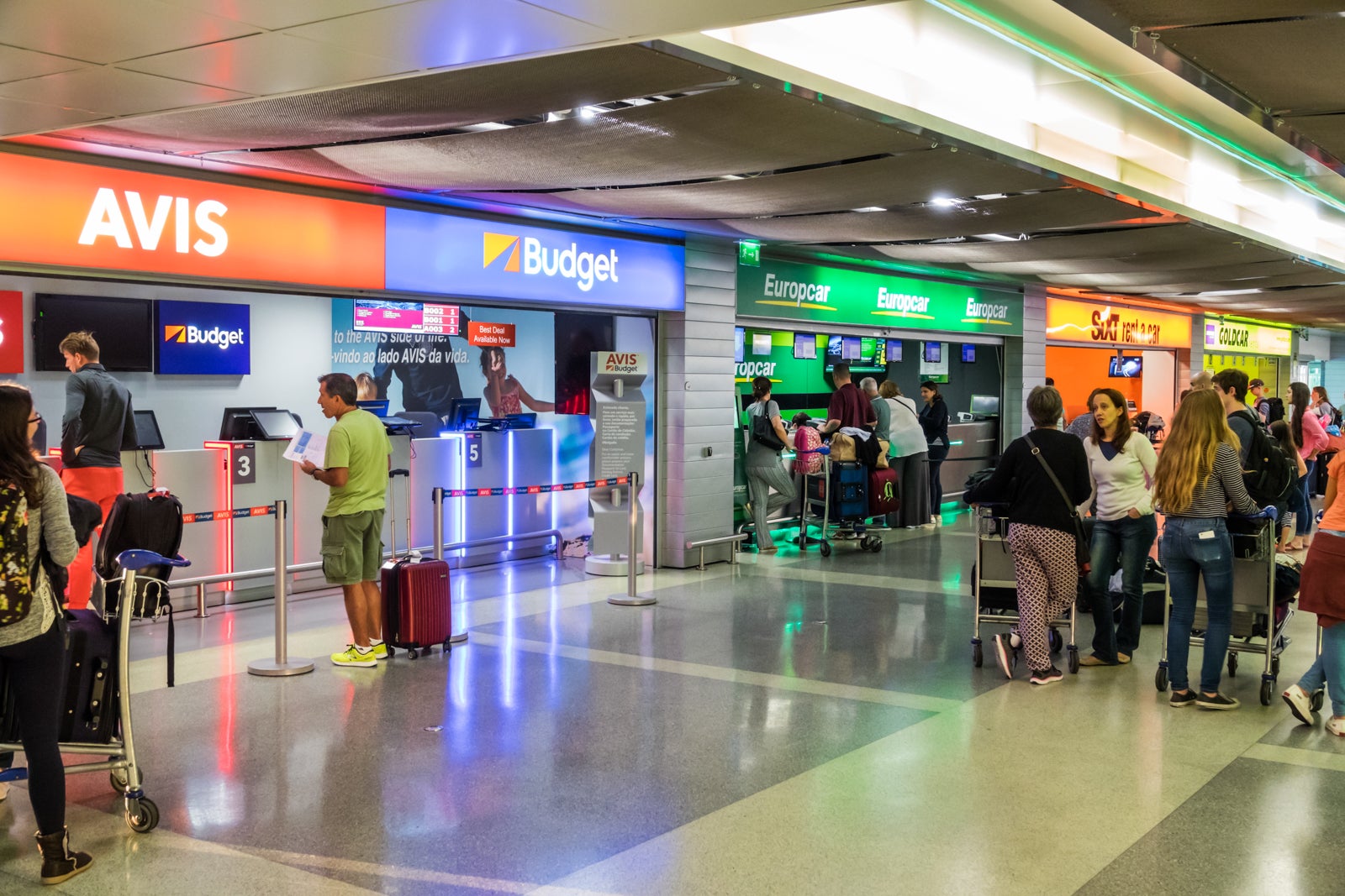 row of rental car checkin counters at airport