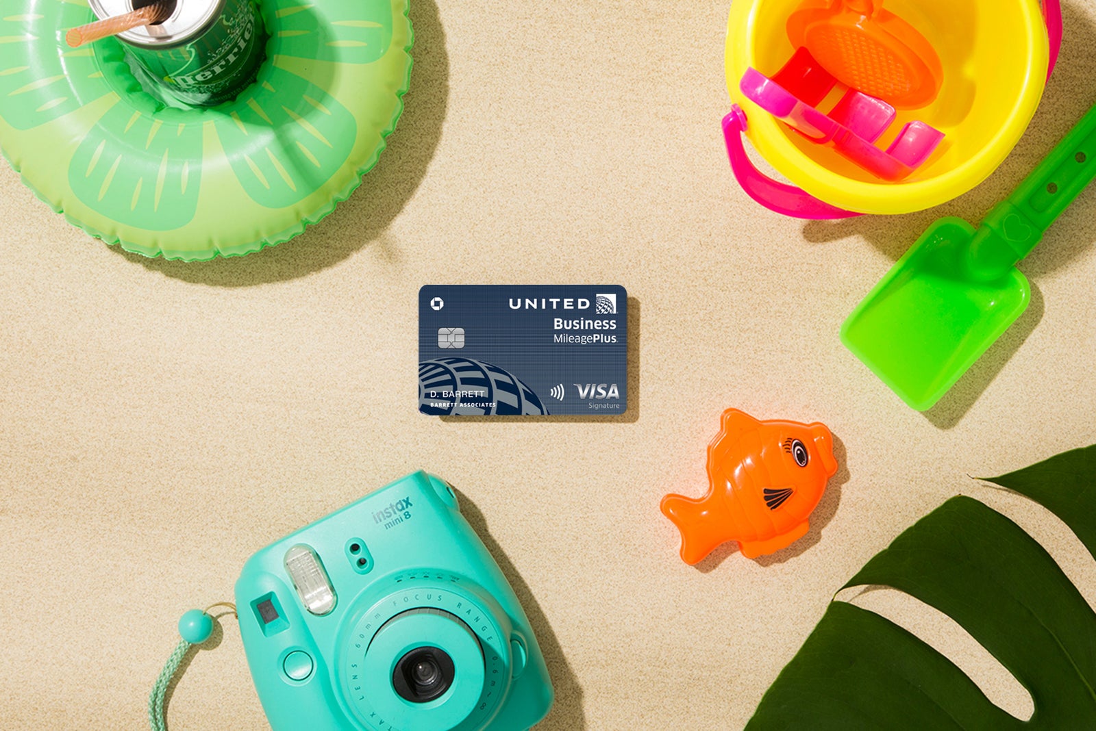 a credit card surrounded by toys and a camera