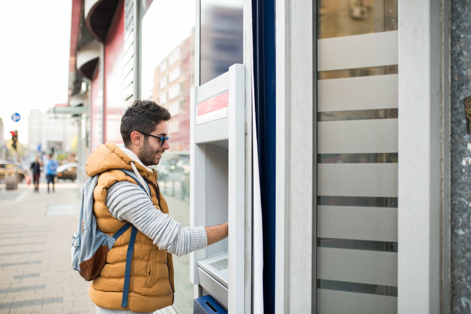 person at ATM