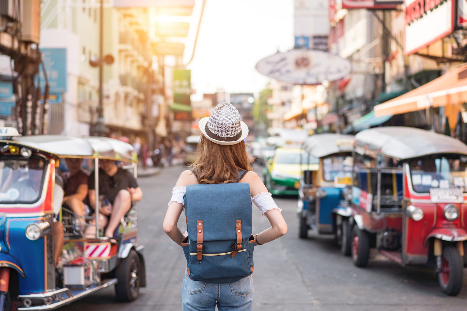 Women with a backpack walking through the city