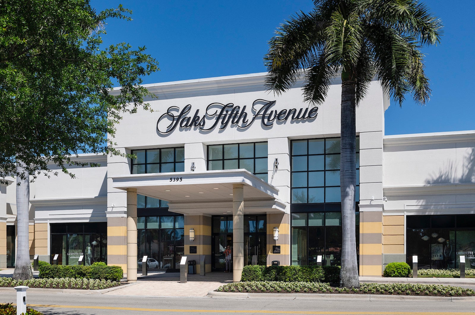 a Saks Fifth Avenue store is seen from the parking lot