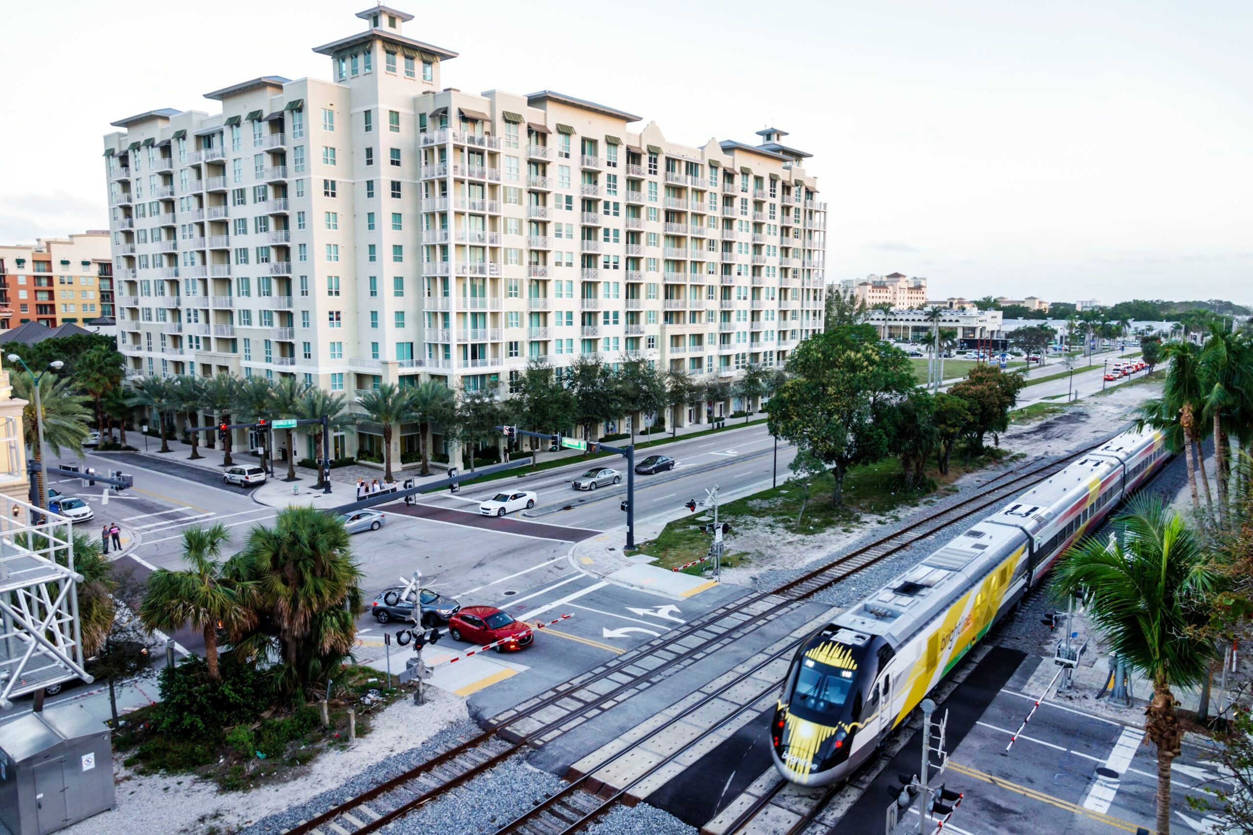 West Palm Beach, City Palms Condominium Complex and streets with Brightline train