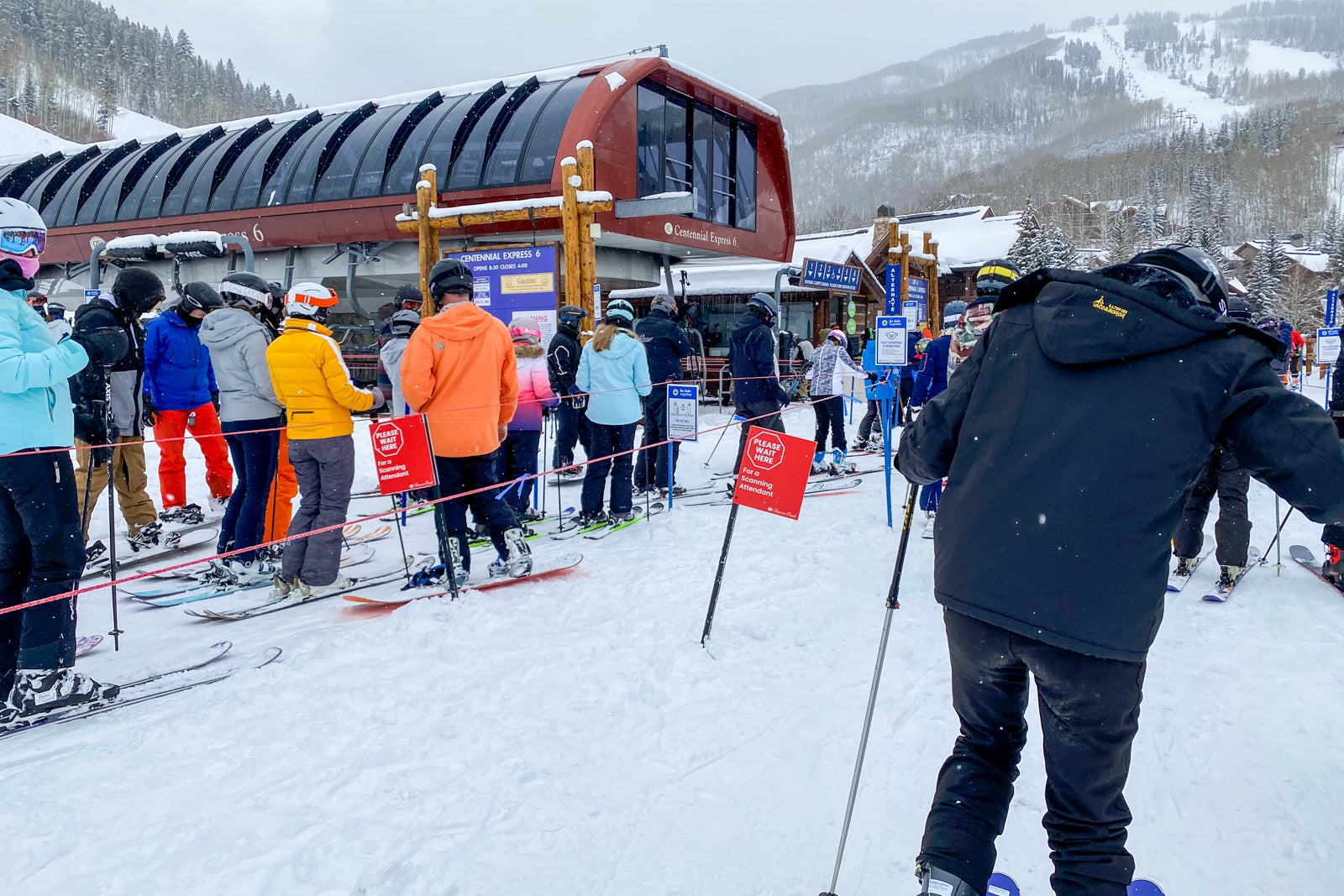 skiers in lift line