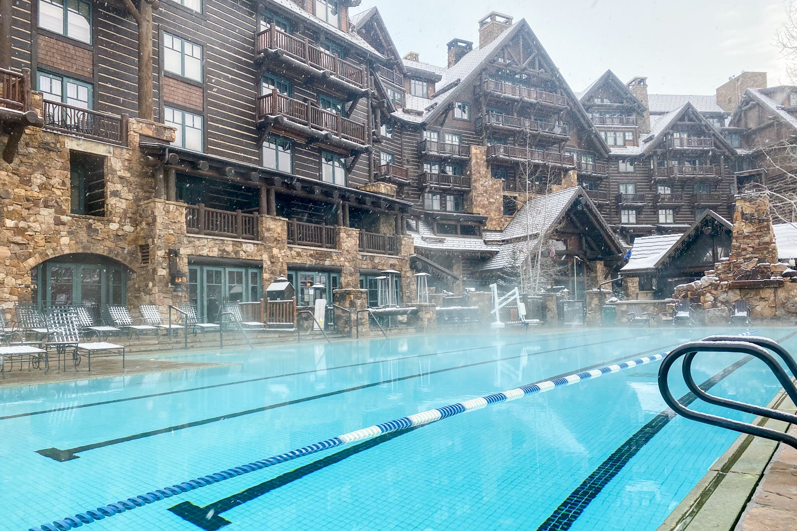 a pool outside a hotel room in winter