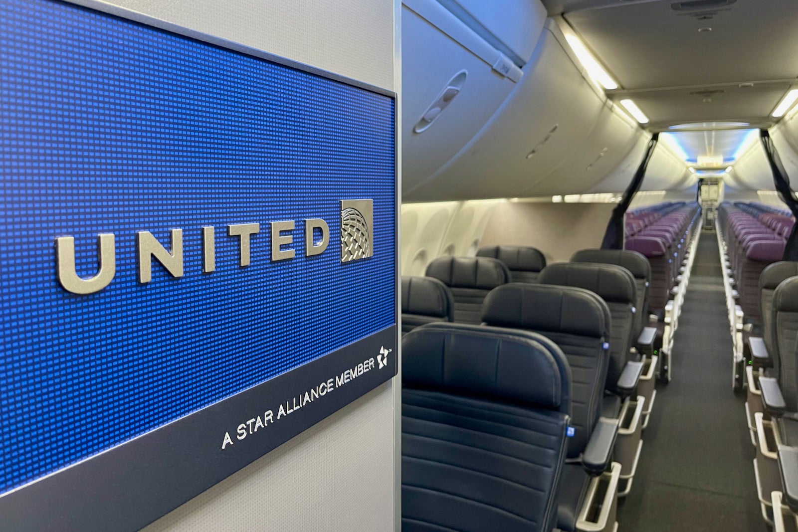 a United sign inside an empty plane