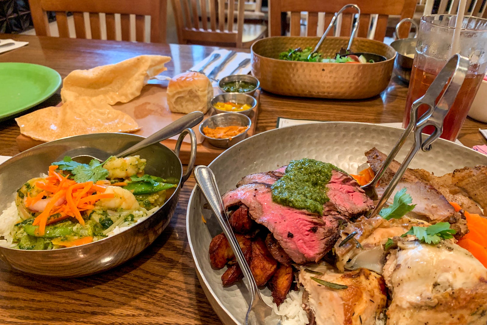 plates of meat and vegetables on a table at Tusker House Restaurant in Animal Kingdom at Walt Disney World