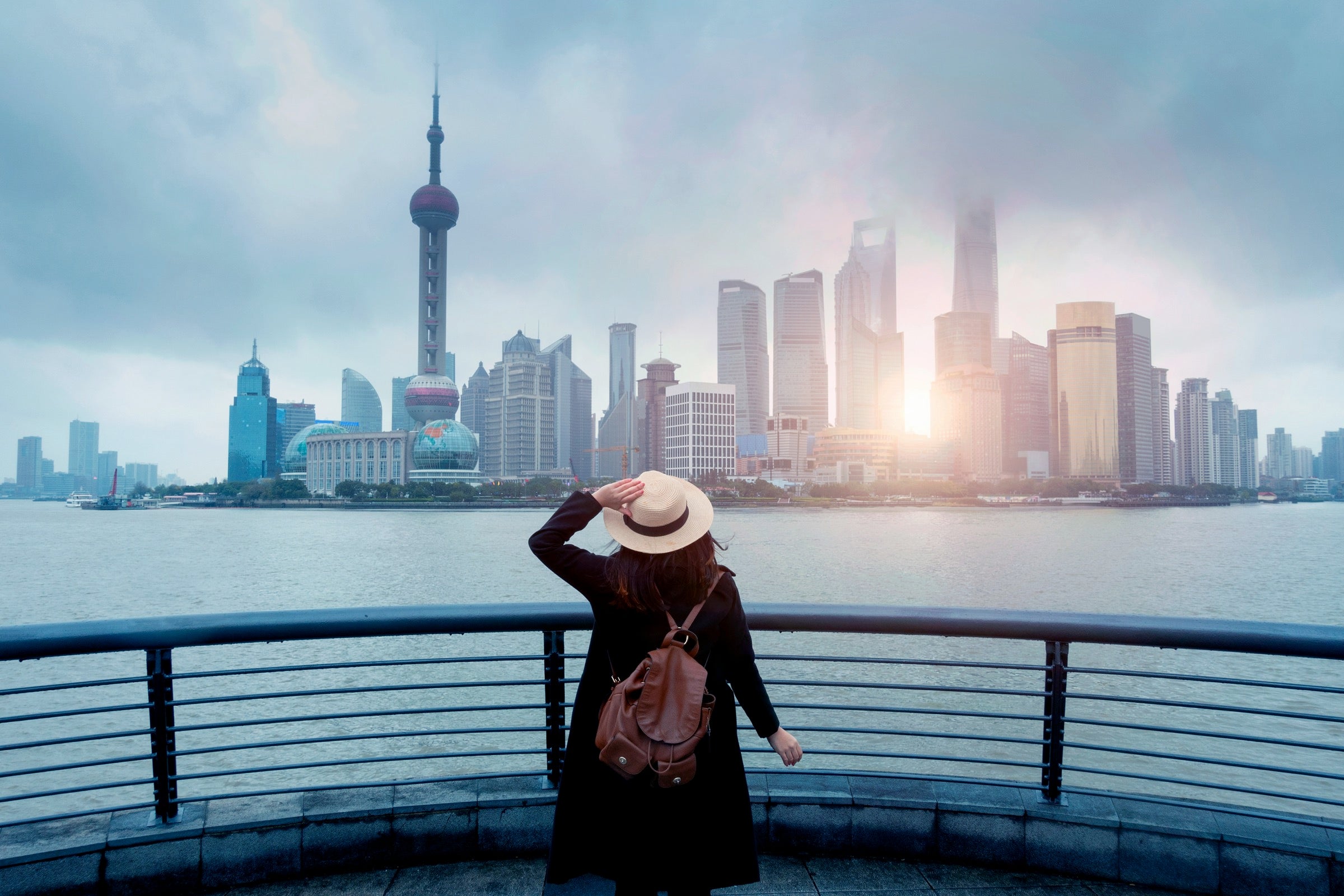 Woman standing in front of the Shanghai skyline