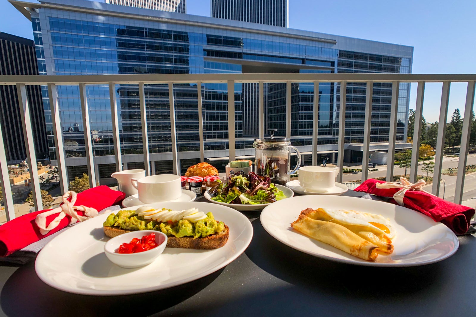 breakfast spread on balcony table