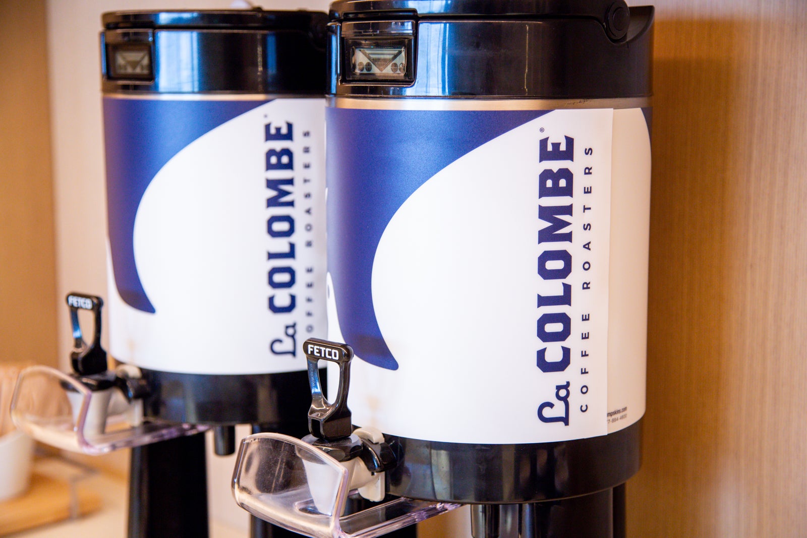 close-up of La Columbe coffee with branding waiting to be served