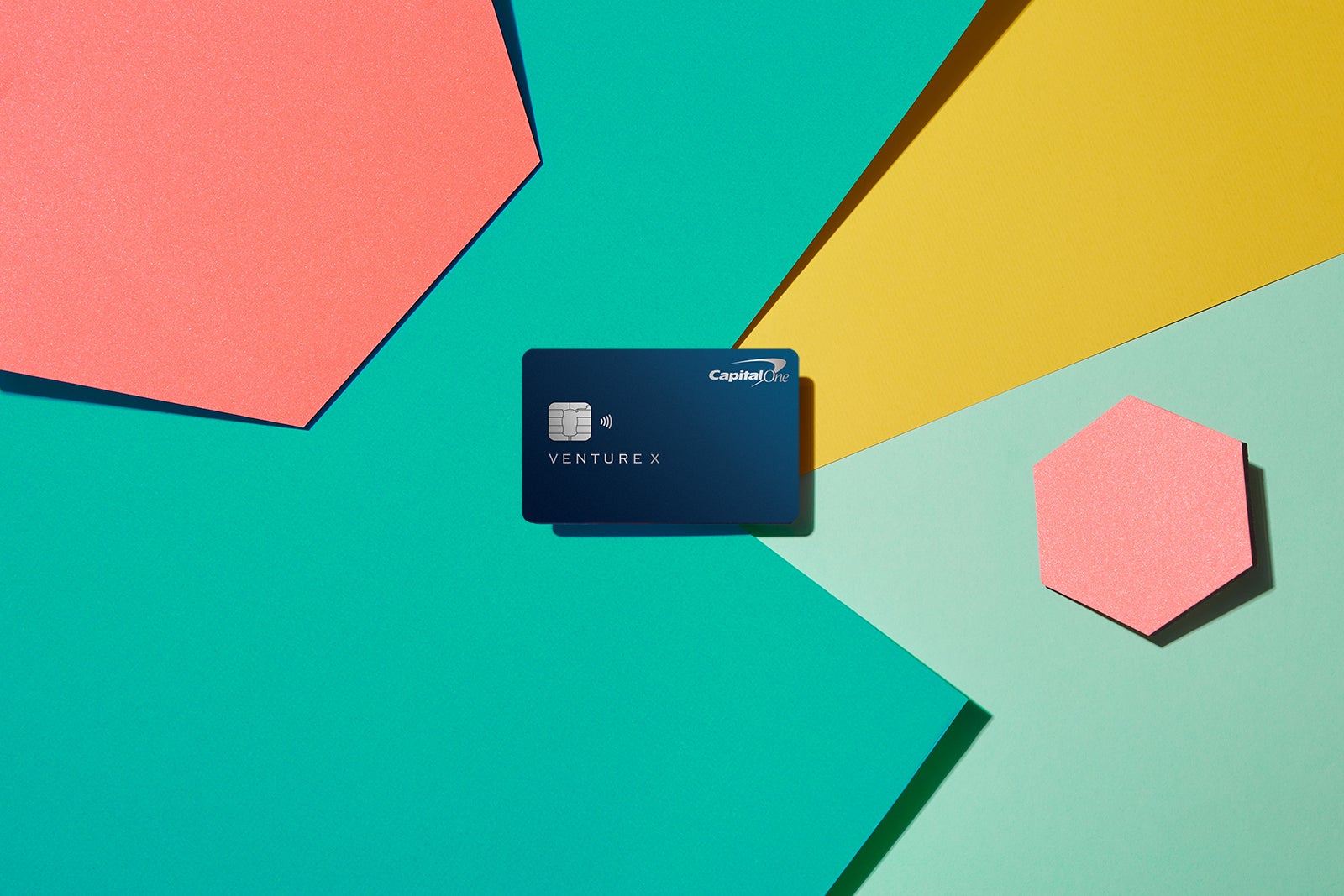 a credit card against a multi-colored background