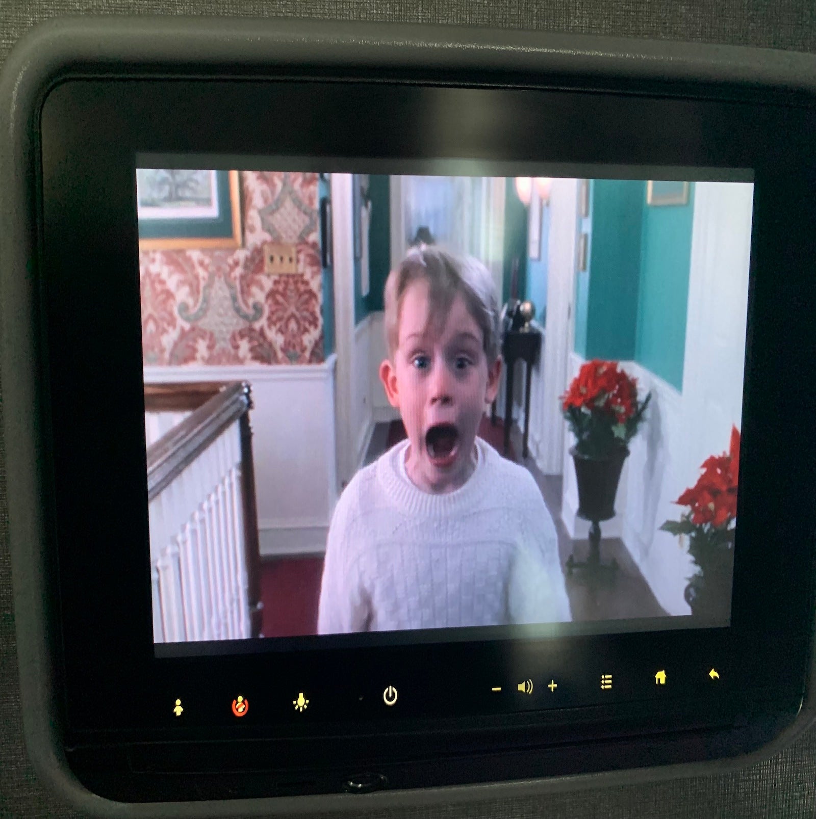 home alone movie on airplane screen