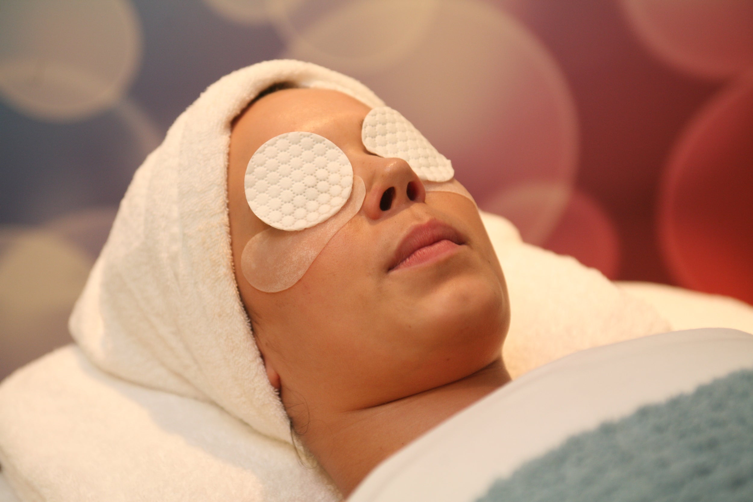 Woman relaxing during a cruise ship spa treatment