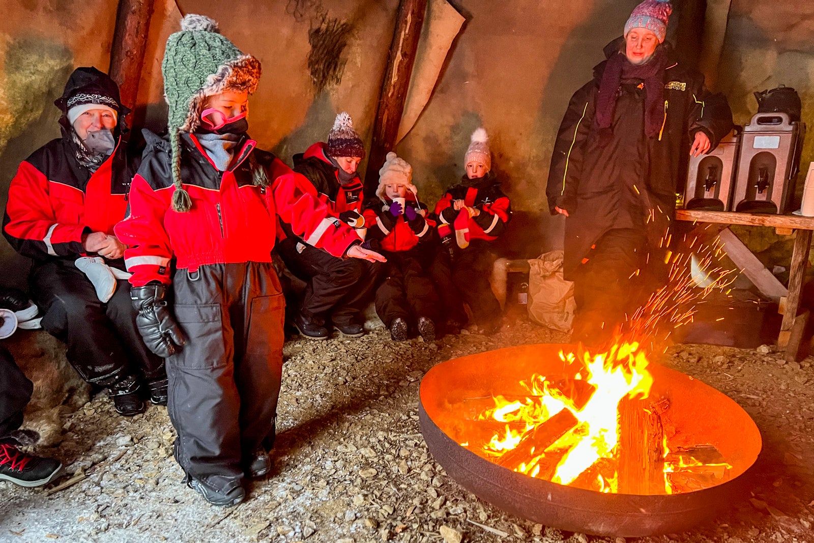 people warming up by the fire