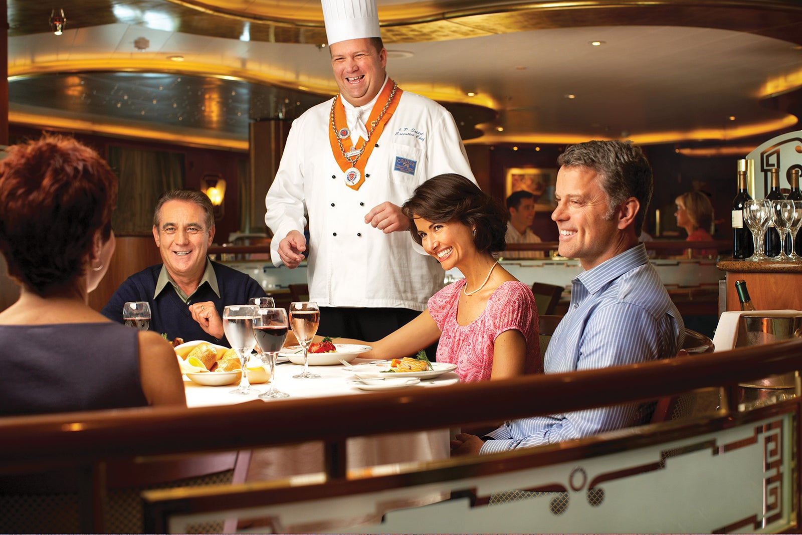 Two couples talk with sommelier in Princess Cruise main dining room