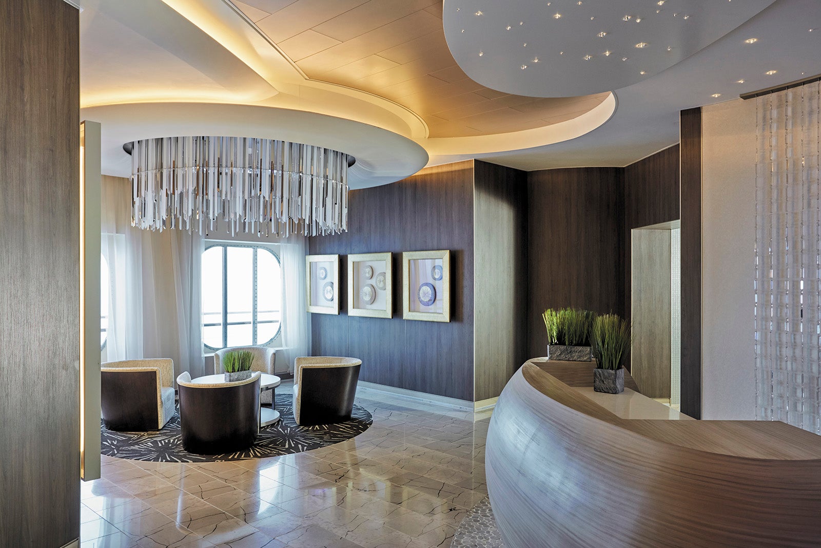 Reception desk and serene sitting area at spa on Regent Seven Seas cruise ship