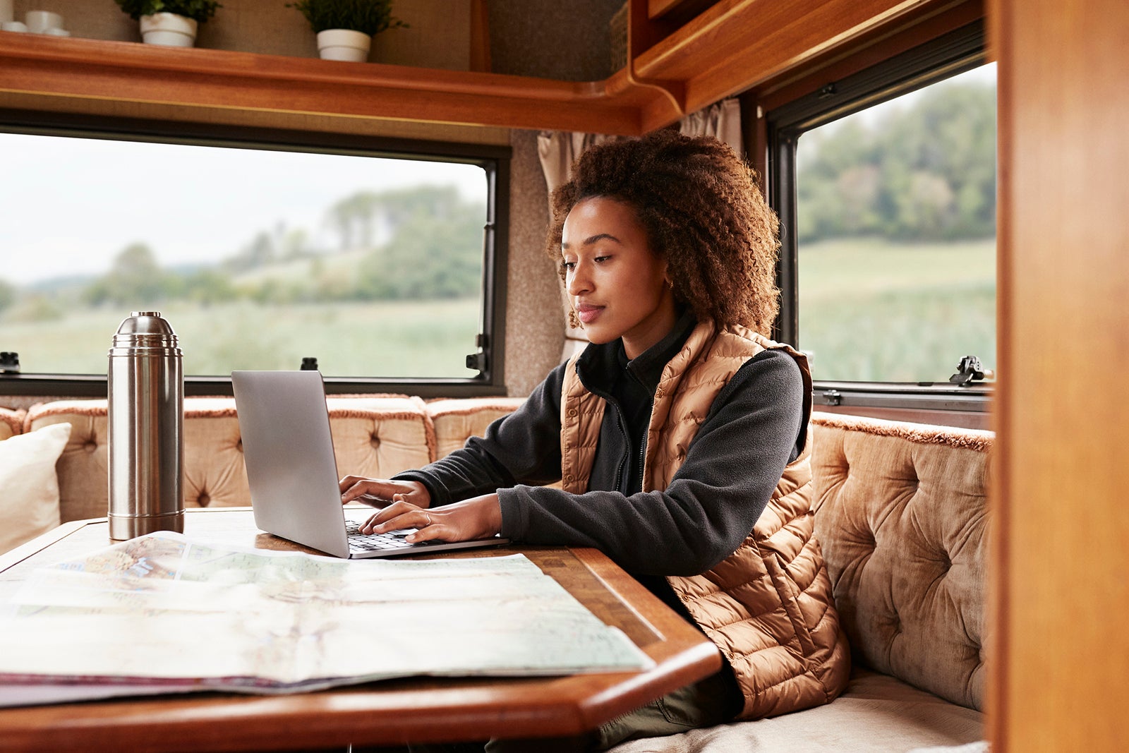 Person on laptop in an RV