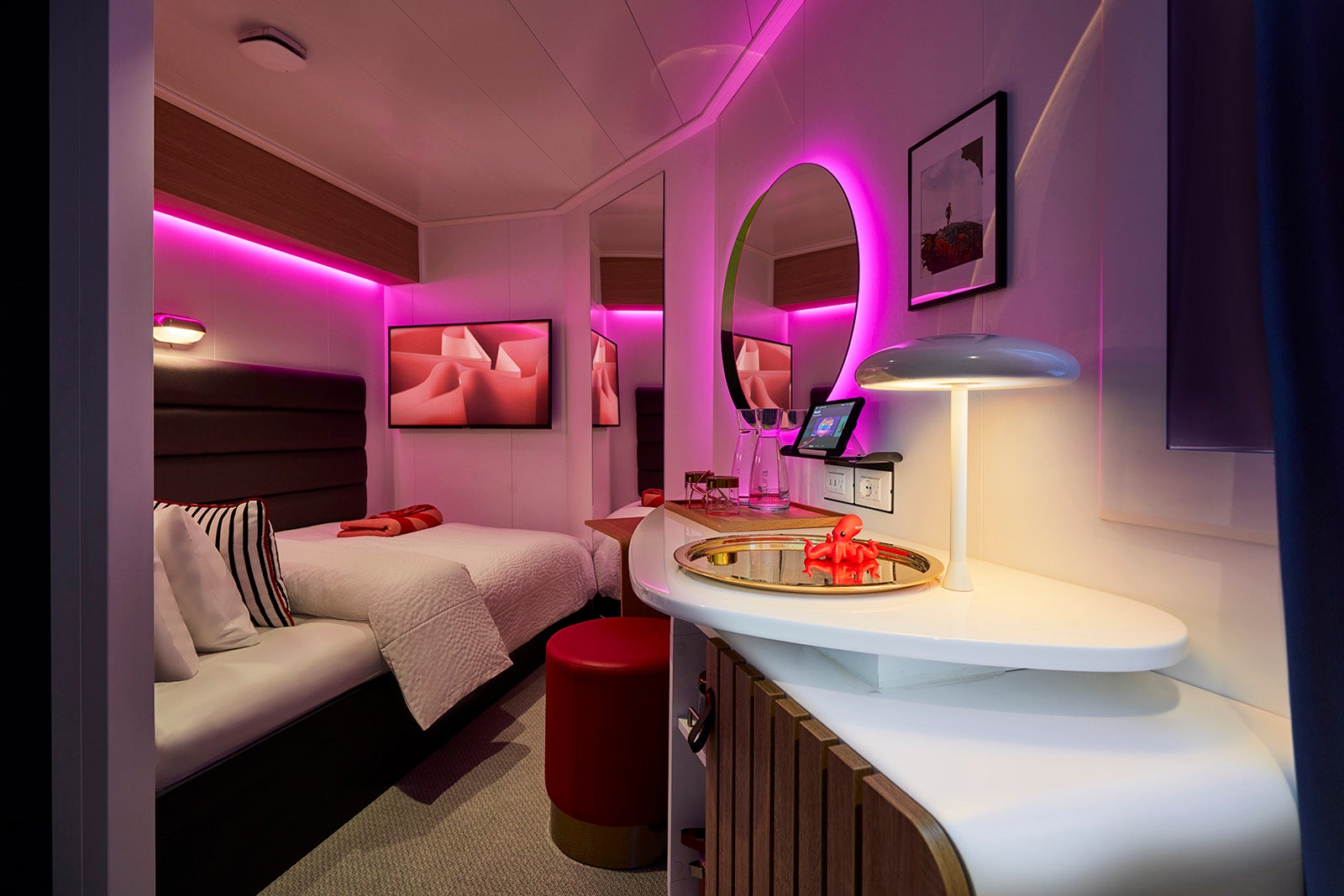Interior of Virgin Voyages cruise cabin with mood lighting
