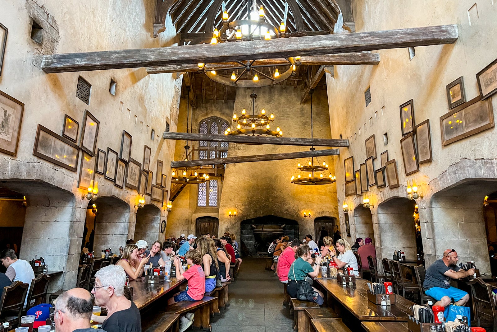 Guests dining at long tables at The Leaky Cauldron