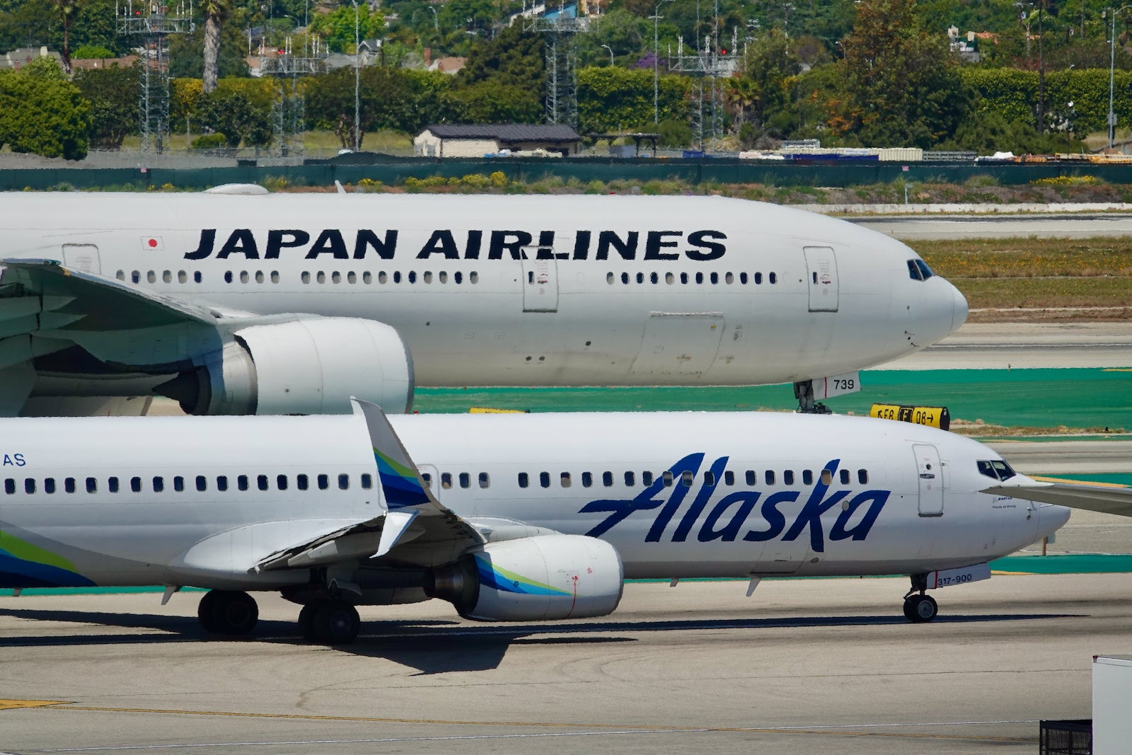 Japan Airlines and Alaska planes