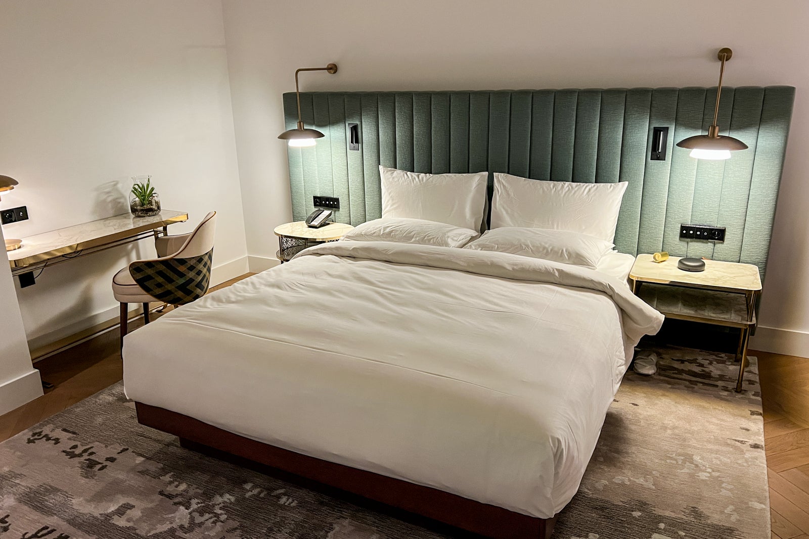 Bed and workspace at the Andaz Prague hotel