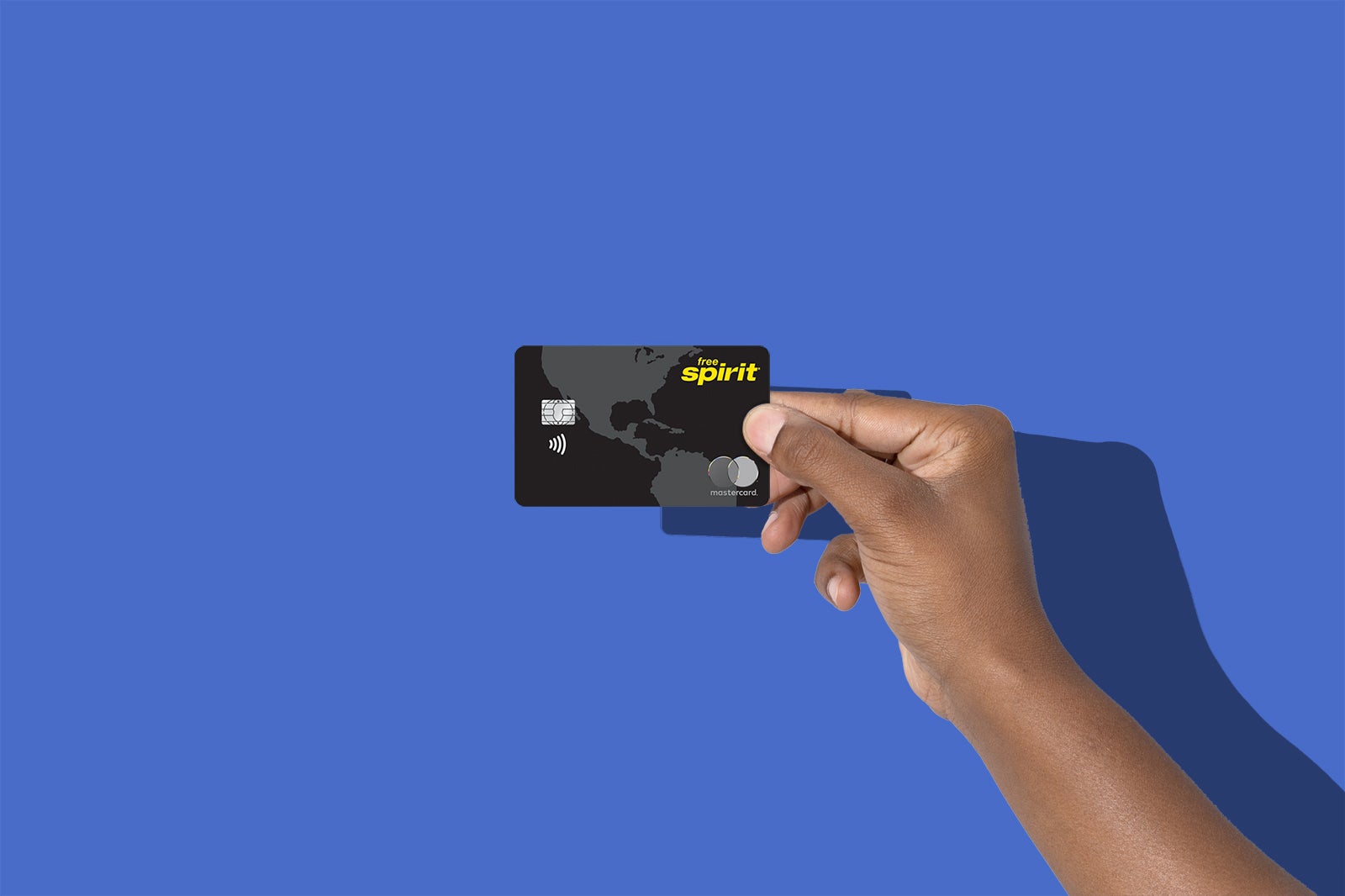 a hand holding a credit card