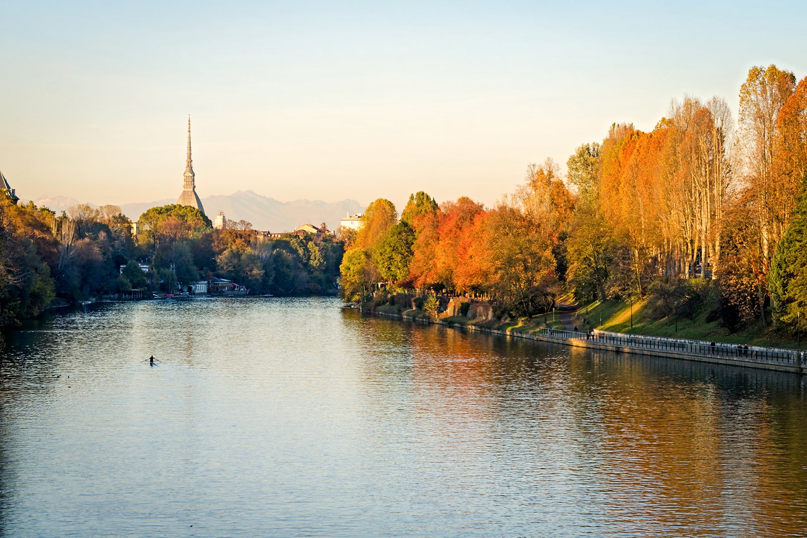 Fall foliage dots the riverbank along part of the Po River in Italy