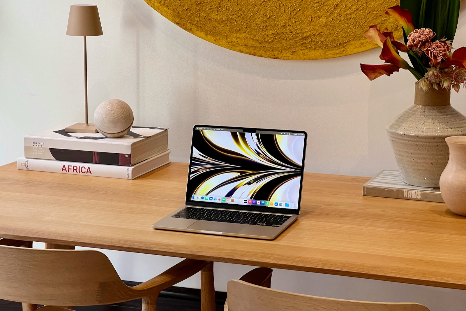 apple laptop sitting open on a desk