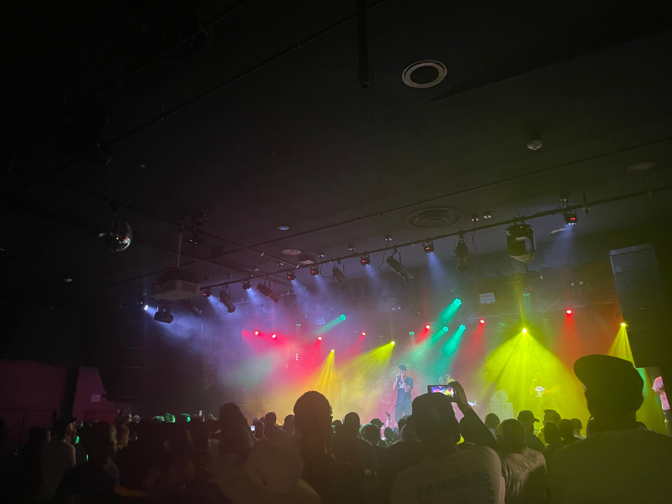 A concert with lots of colorful lights