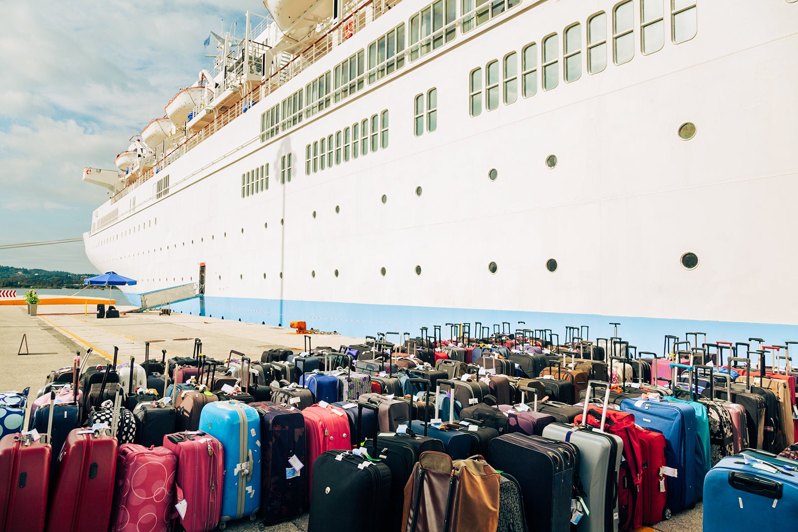 pile of suitcases next to ship