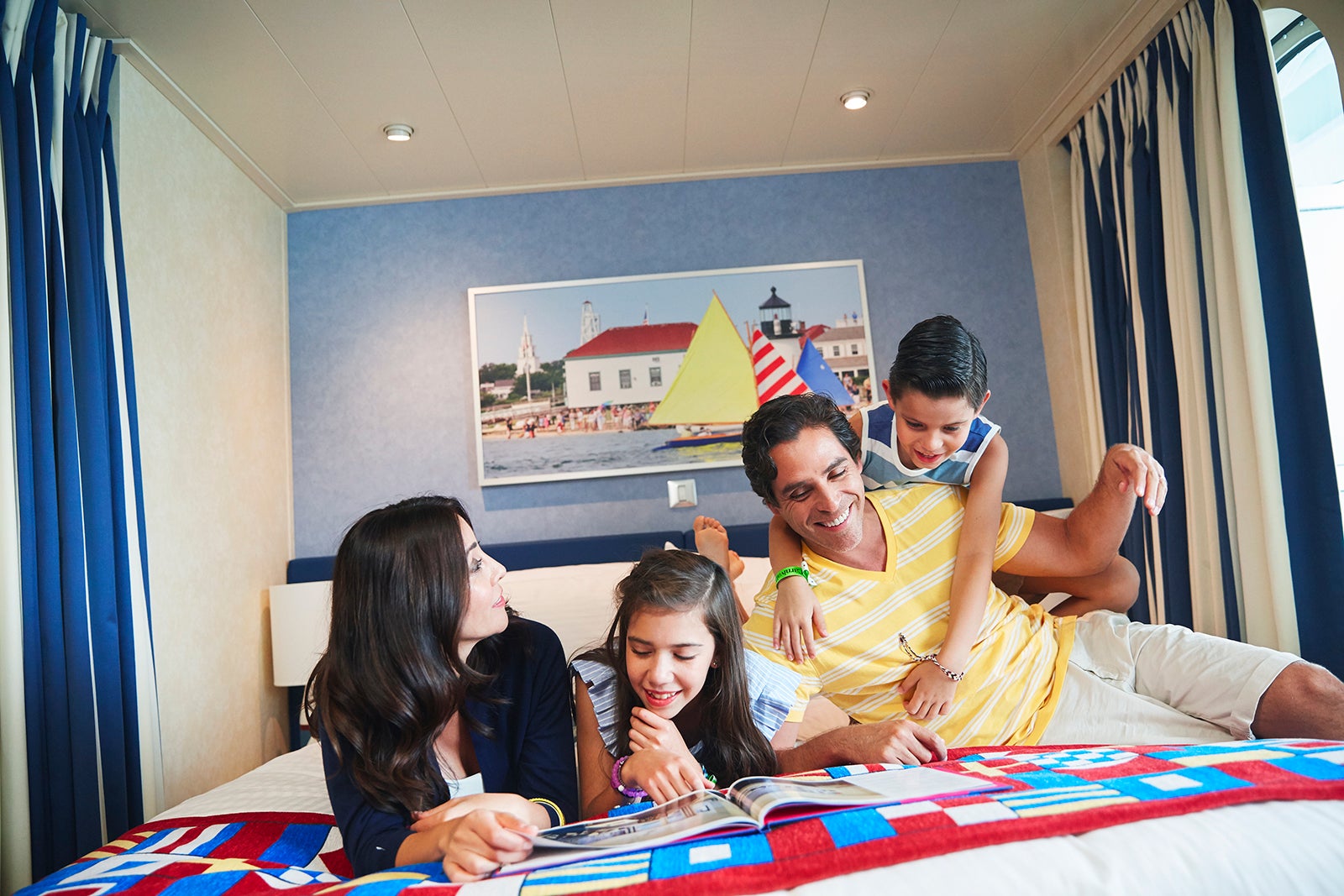 Family of four on cruise ship bed