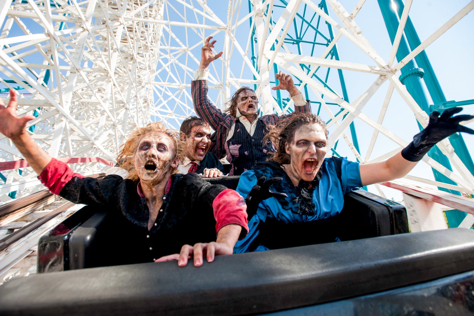 people in costume on roller coaster