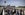 Travelers wait in line outside at Schiphol Airport