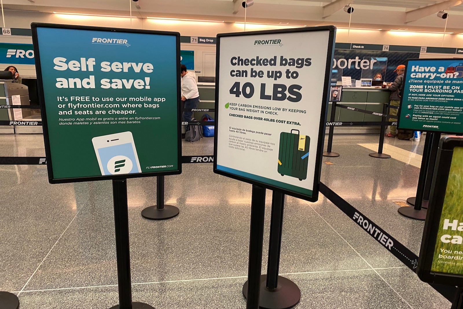 Frontier check-in desk and signs