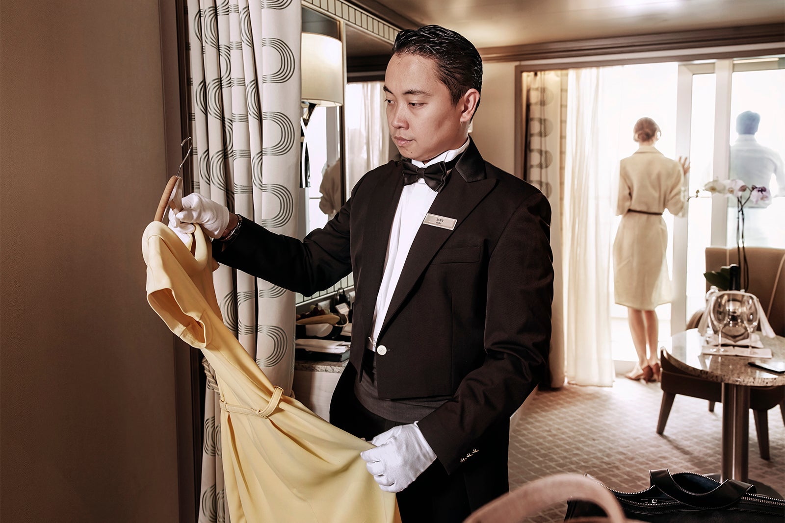 Silversea Cruises butler unpacks the guests' suitcase.