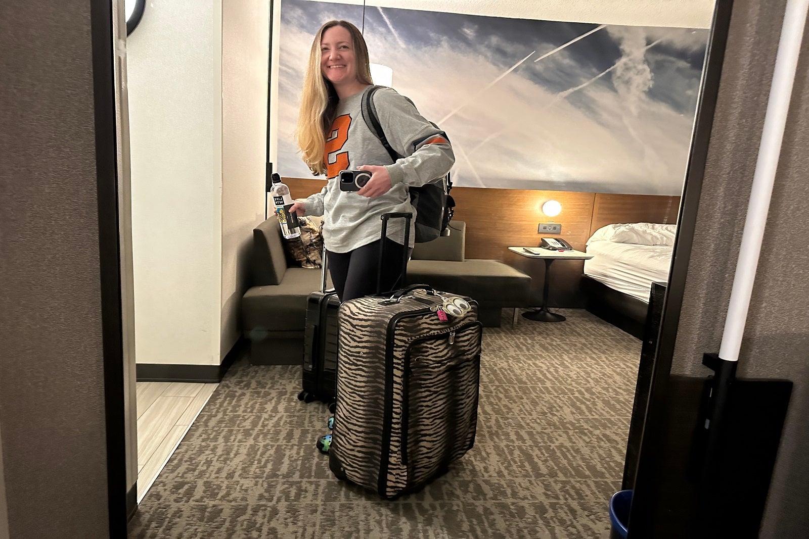 Ashley holding the suitcase