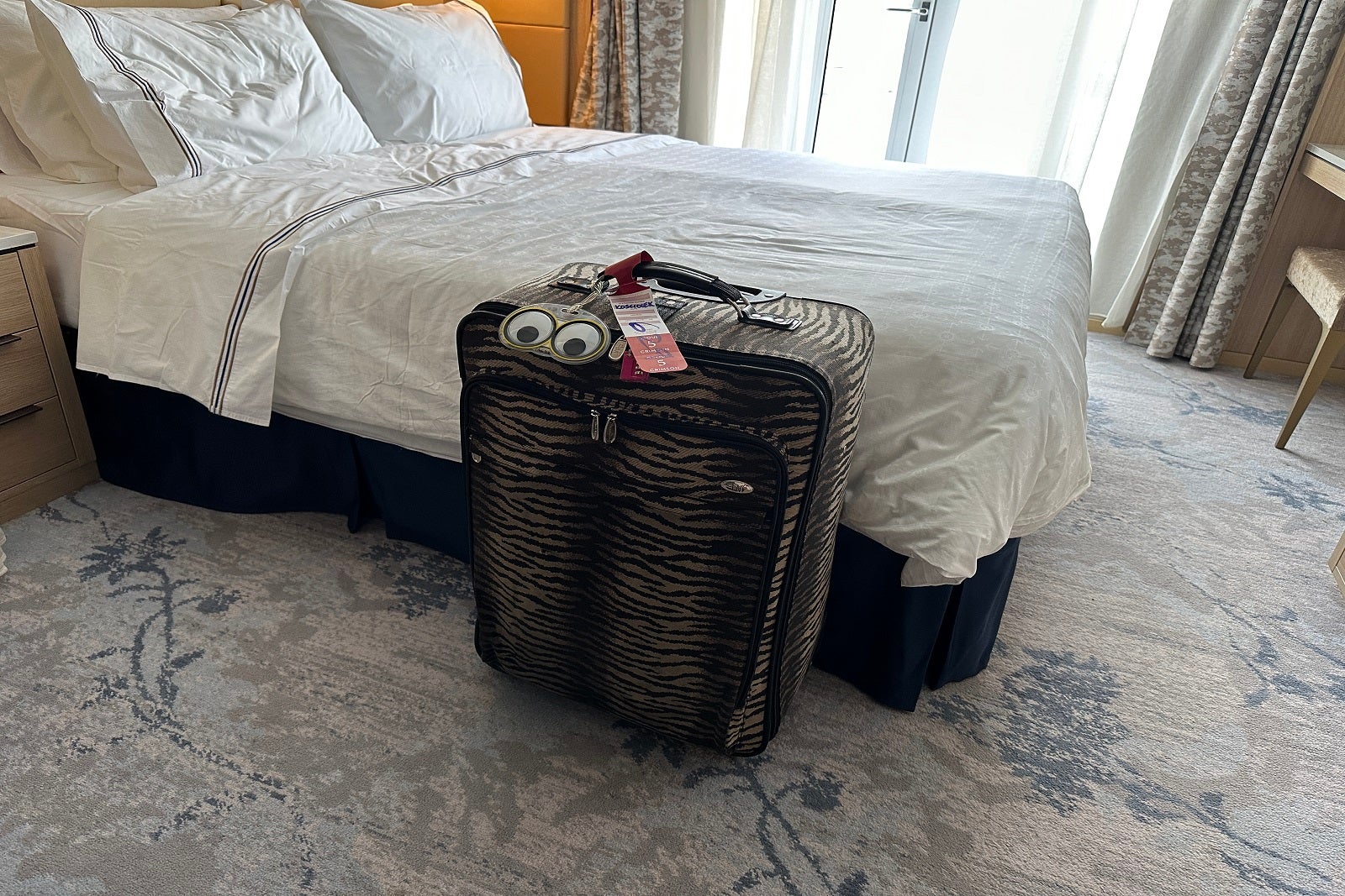 the suitcase in a hotel room