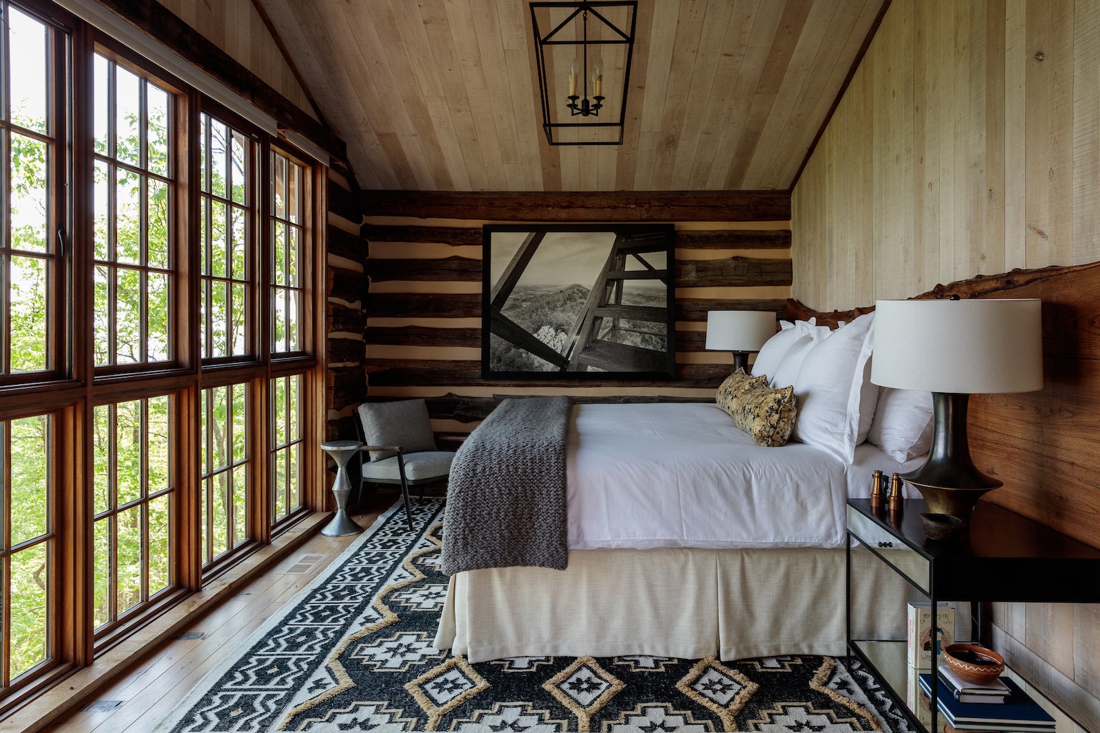 Lodge bedroom with large windows