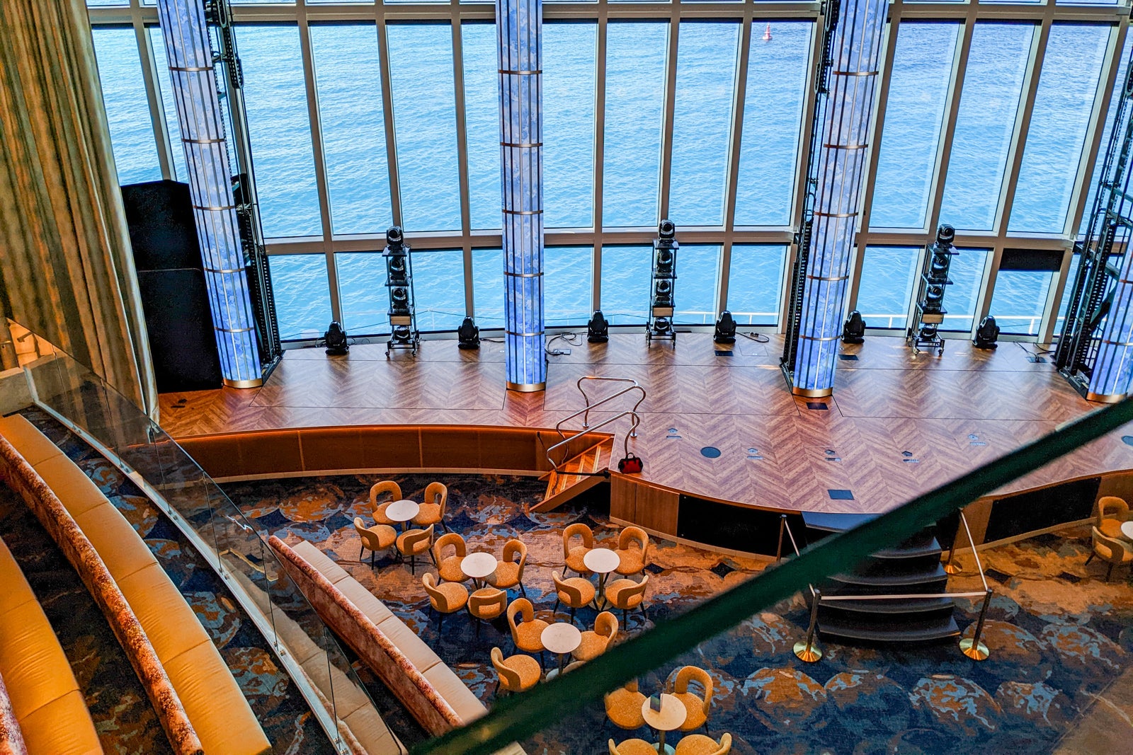 Panoramic windows behind stage on Carnival Celebration