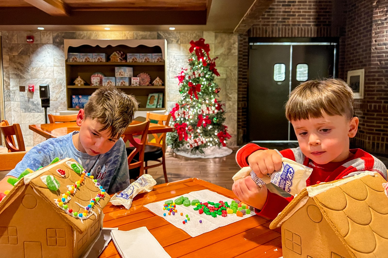 Two children building gingerbread houses at a Gaylord Hotel