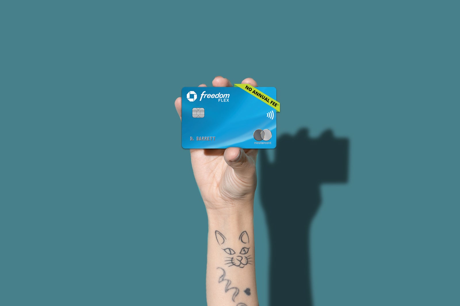 a hand holds a Chase Freedom Flex credit card