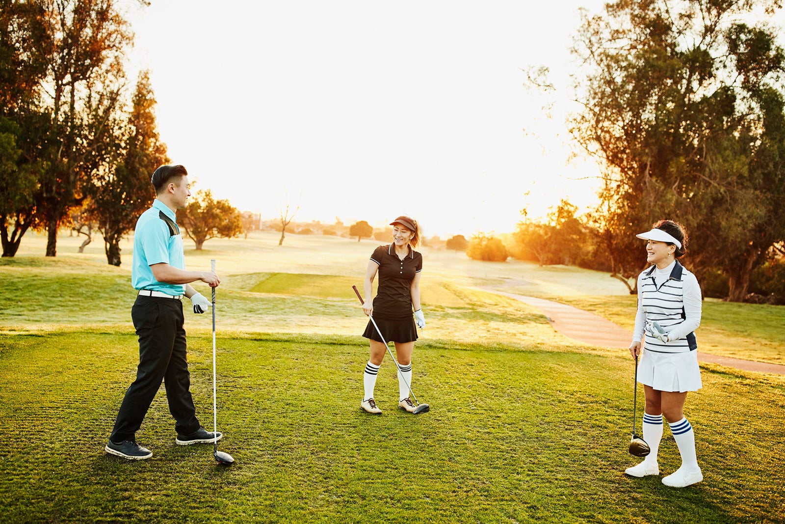 Family playing golf