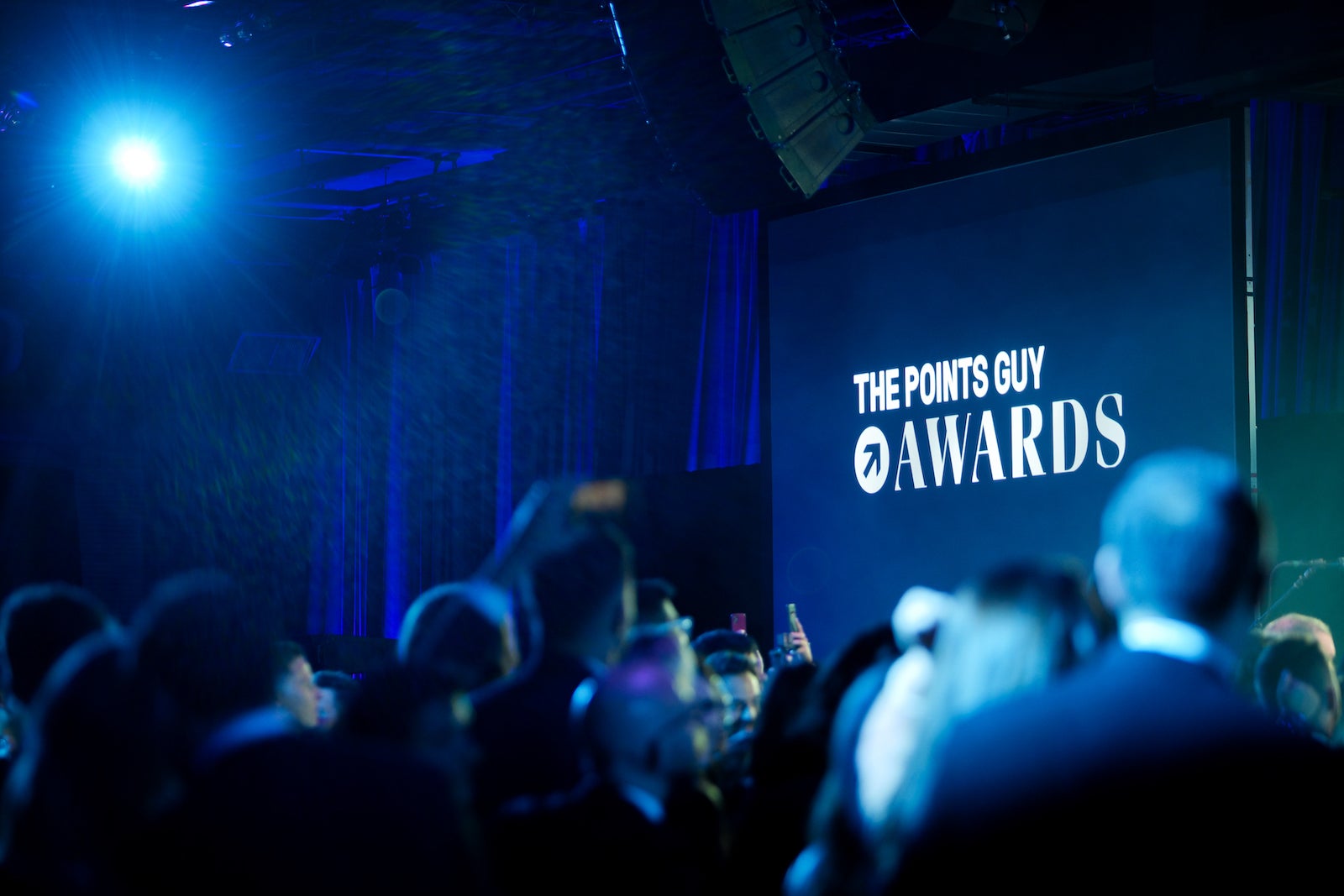 A photo of the TPG Awards stage with guests in the foreground.