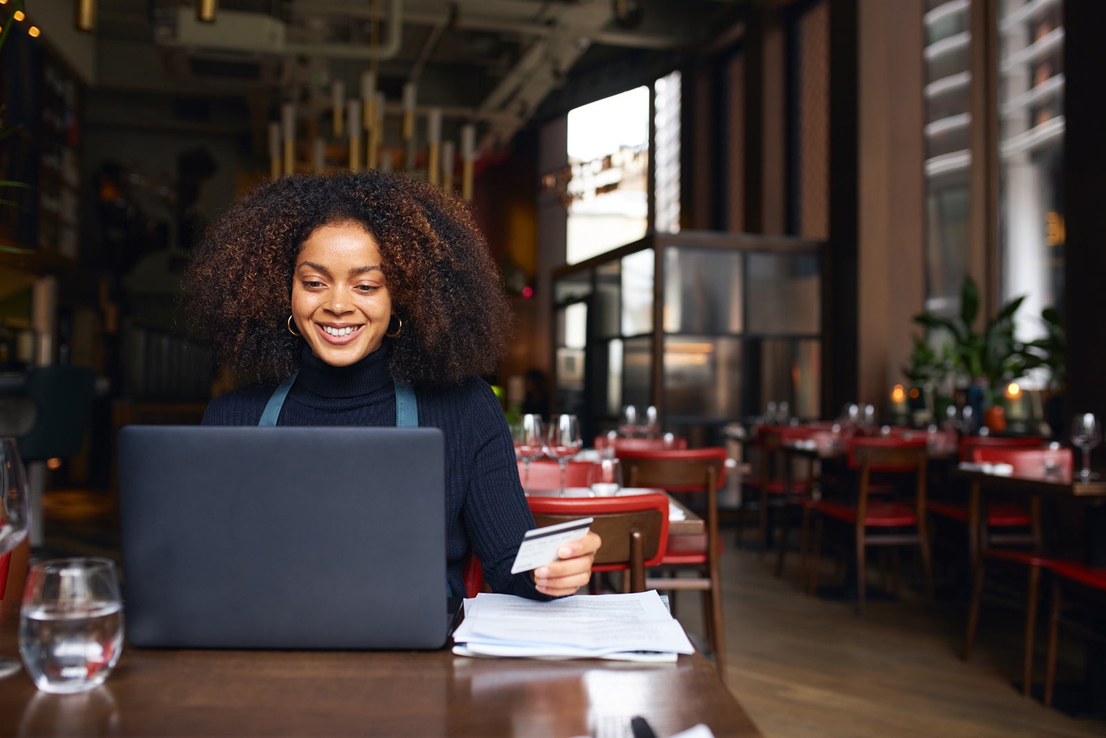 Restaurant owner using laptop